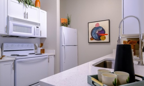 a kitchen with white appliances