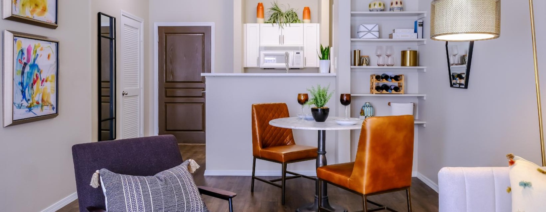 a living room with a table and chairs