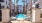 a pool in a courtyard between buildings