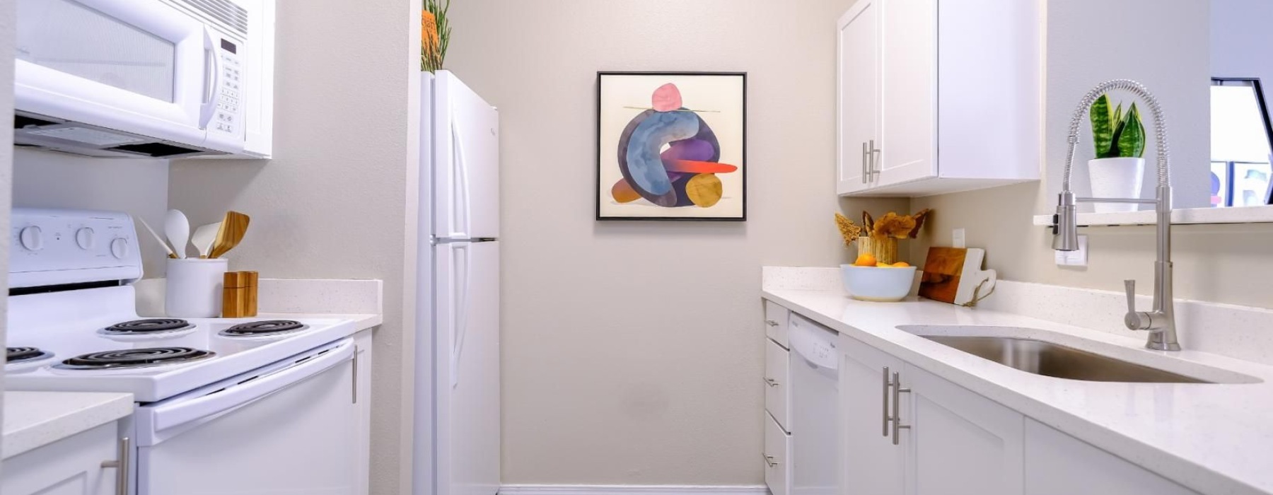 a kitchen with white cabinets
