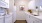 a kitchen with white cabinets