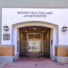a building with a large door and a large arched doorway