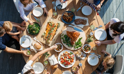 table with food and people
